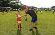 10 December 2017; GPA President David Collins with Cara Jean Sle Summerville during a coaching session and end of season medal presentations at the Singapore Gaelic Lions GAA training session at The Grandstand, Turf Club Rd, Bukit Timah, Singapore  Photo by Ray McManus/Sportsfile