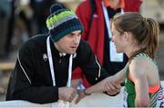 14 December 2014; Ireland's Fionnuala Britton is consoled by team physiotherapist Declan Monaghan after finishing in sixth place in the Women's race. Spar European Cross Country Championships, Samokov, Bulgaria. Picture credit: Ramsey Cardy / SPORTSFILE