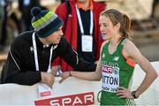 14 December 2014; Ireland's Fionnuala Britton is consoled by team physiotherapist Declan Monaghan after finishing in sixth place in the Women's race. Spar European Cross Country Championships, Samokov, Bulgaria. Picture credit: Ramsey Cardy / SPORTSFILE