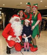21 December 2017; The annual migration home for Christmas is now in full swing, with passenger arrivals in Dublin airport increasing each day right up until Saturday 23rd December. It’s a very emotional and joyous occasion for families, separated by distance throughout the year but reuniting in the Arrivals hall in Dublin Airport to celebrate Christmas. OCS Ireland will be there on the ground over the entire holiday period. Assisting passengers through its Reduced Mobility Service (PRM) thus allowing the passengers to saviour the occasion and the joy of coming home for Christmas. In 2017 OCS assisted in excess of 290,000 passengers. The specially trained Care Agents will ensure a safe journey through the airport this Christmas for passengers who require assistance of any kind with the few to reducing fear and anxiety while navigating the airport. Pictured is 3 year old Alice Walker, from Dundalk, Co Louth, with Santa Claus and his elves at Dublin Airport in Dublin. Photo by Matt Browne/Sportsfile
