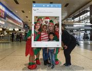 21 December 2017; The annual migration home for Christmas is now in full swing, with passenger arrivals in Dublin airport increasing each day right up until Saturday 23rd December. It’s a very emotional and joyous occasion for families, separated by distance throughout the year but reuniting in the Arrivals hall in Dublin Airport to celebrate Christmas. OCS Ireland will be there on the ground over the entire holiday period. Assisting passengers through its Reduced Mobility Service (PRM) thus allowing the passengers to saviour the occasion and the joy of coming home for Christmas. In 2017 OCS assisted in excess of 290,000 passengers. The specially trained Care Agents will ensure a safe journey through the airport this Christmas for passengers who require assistance of any kind with the few to reducing fear and anxiety while navigating the airport. Pictured are Erika Rivera, from San Francisco, USA, with her children, Jheudys, age 4, and Jheidelys, age 8, with Santa Claus and his Elves at Dublin Airport in Dublin. Photo by Matt Browne/Sportsfile