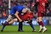 26 December 2017; Andrew Conway of Munster is tackled by Devin Toner, left, and Dan Leavy of Leinster  during the Guinness PRO14 Round 11 match between Munster and Leinster at Thomond Park in Limerick. Photo by Brendan Moran/Sportsfile