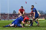 26 December 2017; Conor Murray of Munster scores his side's first try despite the tackle of Dan Leavy of Leinster during the Guinness PRO14 Round 11 match between Munster and Leinster at Thomond Park in Limerick. Photo by Ramsey Cardy/Sportsfile