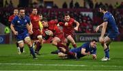 26 December 2017; Ian Keatley of Munster goes over to score his side's second try despite the tackle of James Ryan of Leinster during the Guinness PRO14 Round 11 match between Munster and Leinster at Thomond Park in Limerick. Photo by Brendan Moran/Sportsfile