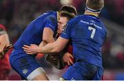 26 December 2017; Rory Scannell of Munster is tackled by Ross Byrne, left, and Dan Leavy of Leinster during the Guinness PRO14 Round 11 match between Munster and Leinster at Thomond Park in Limerick. Photo by Brendan Moran/Sportsfile