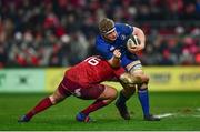 26 December 2017; Dan Leavy of Leinster is tackled by Niall Scannell of Munster during the Guinness PRO14 Round 11 match between Munster and Leinster at Thomond Park in Limerick. Photo by Ramsey Cardy/Sportsfile
