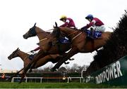 28 December 2017; Road To Respect, centre, with Sean Flanagan up, jumps the last alongside Balko Des Flos, left, with Denis O'Regan up, and Outlander, right, with Jack Kennedy up, on their way to winning the Leopardstown Christmas Steeplechase on day 3 of the Leopardstown Christmas Festival at Leopardstown in Dublin. Photo by Seb Daly/Sportsfile