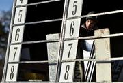 29 December 2017; A racecourse official prepares the jockey board ahead of racing on day 4 of the Leopardstown Christmas Festival at Leopardstown in Dublin. Photo by Seb Daly/Sportsfile
