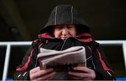 29 December 2017; Robert Hyland from Killiney, Co Dublin, studies the form prior to day 4 of the Leopardstown Christmas Festival at Leopardstown in Dublin. Photo by David Fitzgerald/Sportsfile