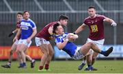 30 December 2017; John O'Loughlin of Laois is tackled by John Egan of Westmeath during the Bord na Móna O’Byrne Cup Group 4 First Round match between Westmeath and Laois at TEG Cusack Park in Westmeath. Photo by Ramsey Cardy/Sportsfile