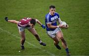 30 December 2017; John O'Loughlin of Laois in action against Finbarr Coyne of Westmeath during the Bord na Móna O’Byrne Cup Group 4 First Round match between Westmeath and Laois at TEG Cusack Park in Westmeath. Photo by Ramsey Cardy/Sportsfile