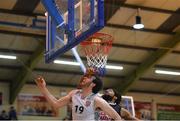 6 January 2018; Jack Kelly of Ballincolligscoring a layup for his side despite the efforts of Antuan Bootle of Scotts Lakers St Paul’s Killarney during the Hula Hoops President’s Cup semi-final match between Scotts Lakers St Paul’s Killarney and Ballincollig at Neptune Stadium in Cork. Photo by Eóin Noonan/Sportsfile
