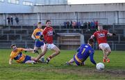13 January 2018; Mark Collins of Cork, under pressure from Cillian Brennan and Tom Hannan, scores his side's first goal past Clare goalkeeper Killlian Roche during the McGrath Cup Final between Cork and Clare at Mallow GAA Complex in Mallow, Co. Cork. Photo by Diarmuid Greene/Sportsfile