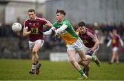 14 January 2018; Jordan Hayes of Offaly in action against Alan Stone, left, and James Dolan of Westmeath during the Bord na Mona O'Byrne Cup semi-final match between Westmeath and Offaly at Cusack Park, in Mullingar, Westmeath. Photo by Sam Barnes/Sportsfile
