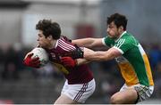 14 January 2018; Callum McCormack of Westmeath in action against David Brady of Offaly during the Bord na Mona O'Byrne Cup semi-final match between Westmeath and Offaly at Cusack Park, in Mullingar, Westmeath. Photo by Sam Barnes/Sportsfile