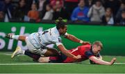 14 January 2018; Keith Earls of Munster scores his side's second try despite the tackle of Teddy Thomas of Racing 92 during the European Rugby Champions Cup Pool 4 Round 5 match between Racing 92 and Munster at the U Arena in Paris, France. Photo by Brendan Moran/Sportsfile