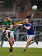 14 January 2018; Graham Reilly of Meath attempts to kick a point under pressure from Patrick Fox of Longford during the Bord na Mona O'Byrne Cup semi-final match between Meath and Longford at Páirc Táilteann in Navan, Meath. Photo by Seb Daly/Sportsfile