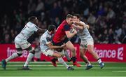 14 January 2018; Chris Farrell of Munster is tackled by Racing 92 players, from left, Wenceslas Lauret, Rémi Tales and Henry Chavancy during the European Rugby Champions Cup Pool 4 Round 5 match between Racing 92 and Munster at the U Arena in Paris, France. Photo by Brendan Moran/Sportsfile