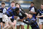 15 January 2018; Deshawn Ighodaro of Dundalk Grammar School is tackled by Johnny Blake and Adam Woolfson of Mount Temple during the Community School Bank of Ireland Leinster Schools Fr. Godfrey Cup Round 1 match between Dundalk Grammar School and Mount Temple at Donnybrook Stadium in Dublin. Photo by Matt Browne/Sportsfile