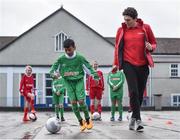 16 January 2018; The SPAR FAI Primary School 5s Programme was launched with a pop up training session at Scoil Mhuire CBS, Dublin, where former Republic of Ireland footballer and past pupil, Keith Andrews and current Republic of Ireland women's footballer, Megan Campbell provided a coaching masterclass to students from Scoil Mhuire CBS and St Vincent de Paul’s Girls NS. The five-a-side school blitzes are open to boys and girls from 4th, 5th and 6th class, and puts emphasis on fun and inclusivity. Register for the SPAR5s by February 9th at www.fai.ie/primary5. Pictured is former Republic of Ireland footballer and past pupil of Scoil Mhuire CBS, Keith Andrews, right, as he coaches current pupil Rey Medina, age 10, at Scoil Mhuire CBS, Clontarf, Dublin. Photo by Seb Daly/Sportsfile