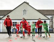 16 January 2018; The SPAR FAI Primary School 5s Programme was launched with a pop up training session at Scoil Mhuire CBS, Dublin, where former Republic of Ireland footballer and past pupil, Keith Andrews and current Republic of Ireland women's footballer, Megan Campbell provided a coaching masterclass to students from Scoil Mhuire CBS and St Vincent de Paul’s Girls NS. The five-a-side school blitzes are open to boys and girls from 4th, 5th and 6th class, and puts emphasis on fun and inclusivity. Register for the SPAR5s by February 9th at www.fai.ie/primary5. Pictured are former Republic of Ireland footballer and past pupil, Keith Andrews, left, as he coaches St Vincent de Paul’s Girls NS pupil Louise Hennessey, age 12, and current Republic of Ireland women's footballer, Megan Campbell, right, as she coaches current Scoil Mhuire CBS pupil Rey Medina, age 10, at Scoil Mhuire CBS, Clontarf, Dublin. Photo by Seb Daly/Sportsfile
