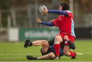 18 January 2018; Daire Guiney of CUS is tackled by David Murphy of Newpark Comprehensive during the Bank of Ireland Leinster Schools Vinnie Murray Cup Round 2 match between Newpark Comprehensive and CUS at Donnybrook Stadium, in Dublin. Photo by Eóin Noonan/Sportsfile