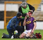20 January 2018; (EDITORS NOTE; This image contains graphic content) Eanna Martin of Wexford receives treatment from team doctor Pat Walsh and physio Harry Goff for a cut over his right eye during the Bord na Mona Walsh Cup Final match between Kilkenny and Wexford at Nowlan Park in Kilkenny. Photo by Matt Browne/Sportsfile