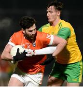 20 January 2018; Aaron Findon of Armagh in action against Jason McGee of Donegal during the Bank of Ireland Dr. McKenna Cup semi-final match between Donegal and Armagh at Celtic Park in Derry. Photo by Oliver McVeigh/Sportsfile