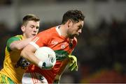 20 January 2018; Oisin MacIomhair of Armagh in action against Eoghan Ban Gallagher of Donegal during the Bank of Ireland Dr. McKenna Cup semi-final match between Donegal and Armagh at Celtic Park in Derry. Photo by Oliver McVeigh/Sportsfile