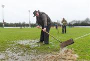 21 January 2018; Tim Ronaldson, from Naas, helps clear water from the pitch ahead of the Bank of Ireland Provincial Towns Cup Round 1 match between Naas and Tullow at Naas RFC in Naas, Kildare. Photo by Sam Barnes/Sportsfile