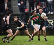 21 January 2018; Evan Regan of Mayo in action against Finnian Cawley, left, Luke Nicholson, and Eddie McGuinness of Sligo during the Connacht FBD League Round 5 match between Sligo and Mayo at James Stephen's Park in Ballina, Co Mayo. Photo by Seb Daly/Sportsfile