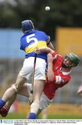 31 July 2003; Cork's Fergus Murphy in action against Tipperary's Martin Maher. Erin Munster Under 21 Hurling Final, Tipperary v Cork, Semple Stadium, Co. Tipperary. Picture credit; Damien Eagers / SPORTSFILE *EDI*
