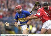 31 July 2003; Tipperary's Diarmuid Fitzgerald in action against Cork's Kieran Murphy. Erin Munster Under 21 Hurling Final, Tipperary v Cork, Semple Stadium, Co. Tipperary. Picture credit; Damien Eagers / SPORTSFILE *EDI*