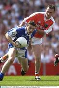 3 August 2003; Ian Fitzgerald of Laois in action against Aidan O'Rourke of Armagh during the Bank of Ireland All-Ireland Senior Football Championship Quarter Final between Laois and Armagh at Croke Park in Dublin. Photo by Ray McManus/Sportsfile