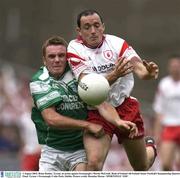 3 August 2003; Brian Dooher, Tyrone, in action against Fermanagh's Martin McGrath. Bank of Ireland All-Ireland Senior Football Championship Quarter Final, Tyrone v Fermanagh, Croke Park, Dublin. Picture credit; Brendan Moran / SPORTSFILE *EDI*