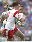 3 August 2003; Enda McGinley, Tyrone, in action against Fermanagh's Ciaran Curley. Bank of Ireland All-Ireland Senior Football Championship Quarter Final, Tyrone v Fermanagh, Croke Park, Dublin. Picture credit; Ray McManus / SPORTSFILE *EDI*