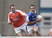 3 August 2003; Tom Kelly of Laois in action against Aidan O'Rourke of Armagh during the Bank of Ireland All-Ireland Senior Football Championship Quarter Final between Laois and Armagh at Croke Park in Dublin. Photo by Brendan Moran/Sportsfile