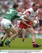3 August 2003; Gerard Cavlan of Tyrone, right, in action against Barry Owens of Fermanagh during the Bank of Ireland All-Ireland Senior Football Championship Quarter Final between Tyrone and Fermanagh at Croke Park in Dublin. Photo by Damien Eagers/Sportsfile