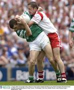 3 August 2003; Barry Owens of Fermanagh, left, in action against Stephen O'Neill of Tyrone during the Bank of Ireland All-Ireland Senior Football Championship Quarter Final between Tyrone and Fermanagh at Croke Park in Dublin. Photo by Damien Eagers/Sportsfile