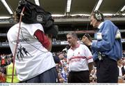 3 August 2003; Tyrone manager Mickey Harte is interviewed by RTÉ television as RTÉ floor manager Tadhg De Brún, right, looks on. Bank of Ireland All-Ireland Senior Football Championship Quarter Final between Tyrone and Fermanagh, Croke Park, Dublin. Photo by Damien Eagers/Sportsfile