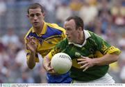 4 August 2003; John Crowley of Kerry in action against Ger Ahern of Roscommon during the Bank of Ireland All-Ireland Senior Football Championship Quarter Final between Kerry and Roscommon at Croke Park in Dublin. Photo by Ray McManus/Sportsfile