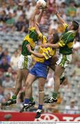 4 August 2003; Eoin Brosnan of Kerry, left, and Darragh O'Se of Kerry in action against Seamus O'Neill of Roscommon during the Bank of Ireland All-Ireland Senior Football Championship Quarter Final between Kerry and Roscommon at Croke Park in Dublin. Photo by Brendan Moran/Sportsfile