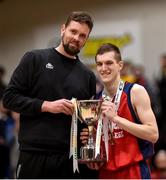 23 January 2018; Templeogue and Ireland basketball player Jason Killeen presents the trophy to Templeogue captain Sam Walsh following the Subway All-Ireland Schools U19A Boys Cup Final match between St Malachy's Belfast and Templeogue College at the National Basketball Arena in Tallaght, Dublin. Photo by David Fitzgerald/Sportsfile