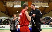 23 January 2018; Templeogue and Ireland basketball player Jason Killeen presents a winner medal to Hugo McDonnell of Templeogue following the Subway All-Ireland Schools U19A Boys Cup Final match between St Malachy's Belfast and Templeogue College at the National Basketball Arena in Tallaght, Dublin. Photo by David Fitzgerald/Sportsfile