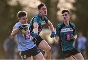 23 January 2018; Conor McCarthy of University College Dublin in action against Cathal Dunne, centre, and James Mooney of Maynooth University during the Electric Ireland HE GAA Sigerson Cup Round 1 match between Maynooth University and University College Dublin at Maynooth University North Campus in Maynooth, Kildare. Photo by Seb Daly/Sportsfile
