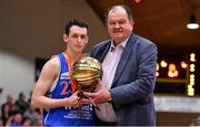 27 January 2018; Liam Carmody of Blue Demons is presented with the MVP by Basketball Ireland General Secretary Bernard O'Byrne after the Hula Hoops NICC Men’s National Cup Final match between Blue Demons and BC Leixlip Zalgiris at the National Basketball Arena in Tallaght, Dublin. Photo by Brendan Moran/Sportsfile