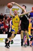27 January 2018; Declan Wall of Keane's Supervalu Killorglin has his shot blocked by Dylan Corkery of Ballincollig during the Hula Hoops President’s Cup Final match between Ballincollig and Keane’s SuperValu Killorglin at the National Basketball Arena in Tallaght, Dublin. Photo by Brendan Moran/Sportsfile