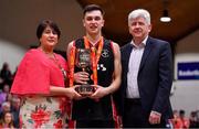 28 January 2018; Kubs captain Stephen Allen is presented with the cup by President of Basketball Ireland Theresa Walsh and Frank Cashman, NABC Member, after the Hula Hoops Under 20 Men’s National Cup Final match between Moycullen and KUBS at the National Basketball Arena in Tallaght, Dublin. Photo by Brendan Moran/Sportsfile