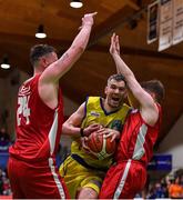 27 January 2018; Neil Baynes of UCD Marian is blocked by Jason Killeen, left, and Baolach Morrison of Black Amber Templeogue during the Hula Hoops Pat Duffy National Cup Final match between UCD Marian and Black Amber Templeogue at the National Basketball Arena in Tallaght, Dublin. Photo by Brendan Moran/Sportsfile