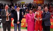 27 January 2018; Black Amber Templeogue captain Stephen James is presented with the Cup by Patrick Baumann, Secretary General, FIBA, in the company of, from left, Bernard O'Byrne, Secretary General, Basketball Ireland, Ian O'Rourke, Largoo Foods and Theresa Walsh, President, Basketball Ireland, during the Hula Hoops Pat Duffy National Cup Final match between UCD Marian and Black Amber Templeogue at the National Basketball Arena in Tallaght, Dublin. Photo by Brendan Moran/Sportsfile